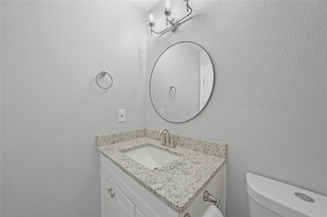 half bath with vanity and toilet