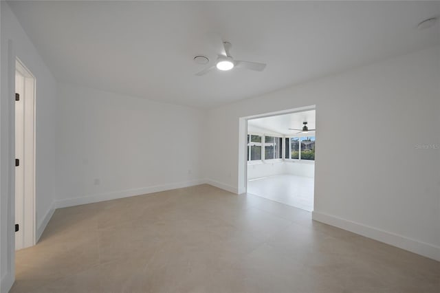 27385 Voyageur Dr, Punta Gorda, FL 33983 - empty room featuring a ceiling fan and baseboards