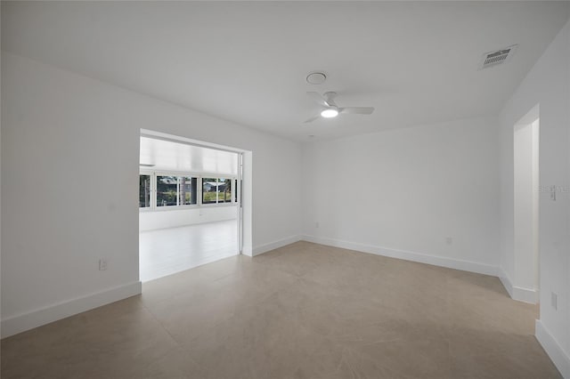 27385 Voyageur Dr, Punta Gorda, FL 33983 - empty room featuring a ceiling fan, baseboards, and light tile patterned floors