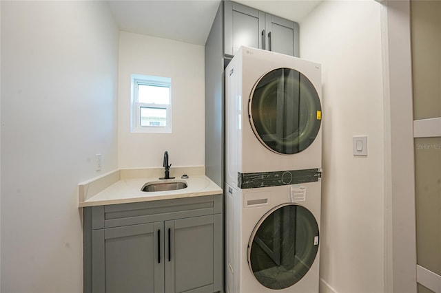 27385 Voyageur Dr, Punta Gorda, FL 33983 - laundry area with stacked washer / dryer and cabinet space