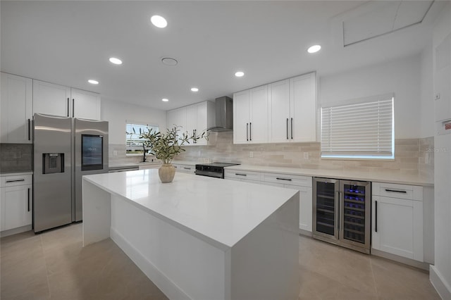 27385 Voyageur Dr, Punta Gorda, FL 33983 - kitchen featuring wine cooler, stainless steel fridge with ice dispenser, wall chimney exhaust hood, electric range oven, and backsplash