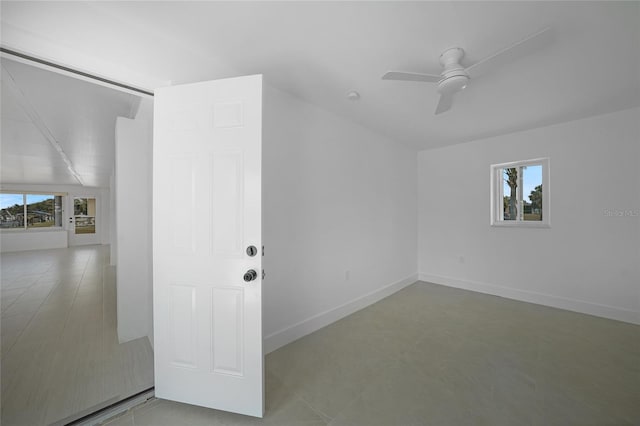 27385 Voyageur Dr, Punta Gorda, FL 33983 - empty room featuring plenty of natural light, a ceiling fan, baseboards, and lofted ceiling