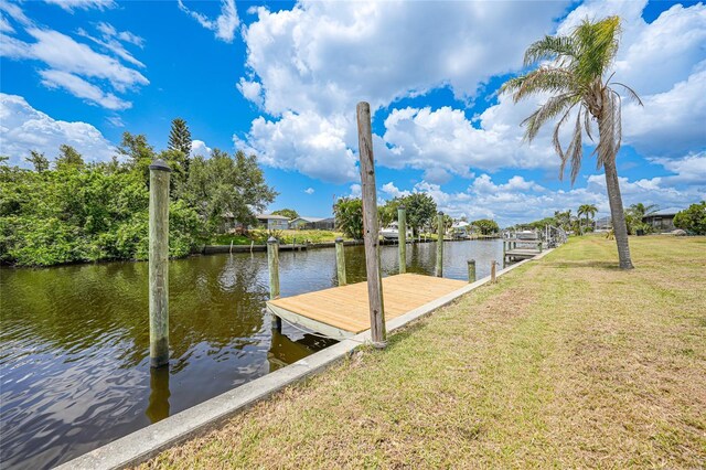 27385 Voyageur Dr, Punta Gorda, FL 33983 - dock area featuring a water view and a lawn