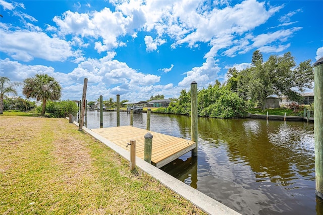 27385 Voyageur Dr, Punta Gorda, FL 33983 - dock area featuring a water view and a lawn
