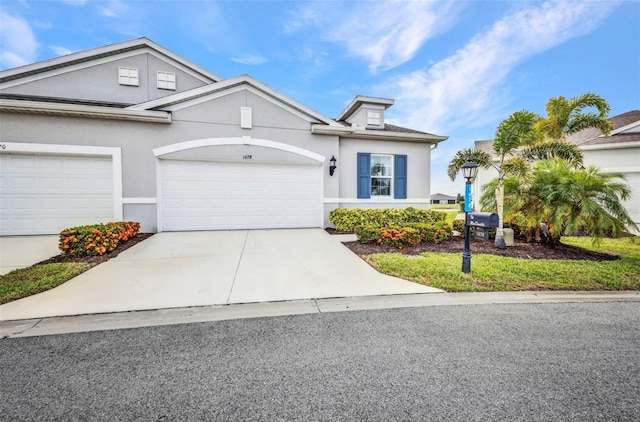 1678 Royal Ct, Punta Gorda, FL 33980 - view of front facade with an attached garage, driveway, and stucco siding