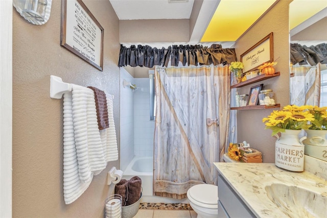 bathroom featuring vanity, tile patterned floors, toilet, and shower / tub combination