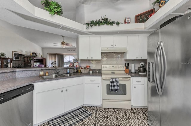 kitchen featuring white cabinets, appliances with stainless steel finishes, a sink, a ceiling fan, and under cabinet range hood