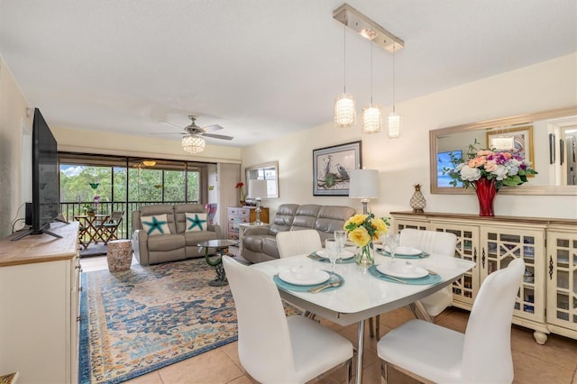 dining area with ceiling fan and light tile patterned floors