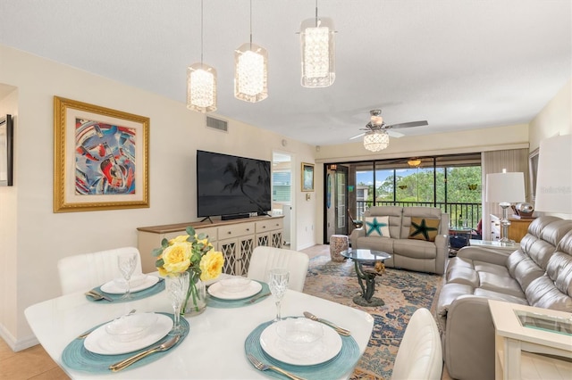 living room featuring visible vents and ceiling fan