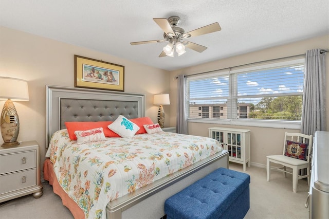 bedroom with light colored carpet, a ceiling fan, baseboards, and multiple windows