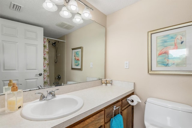 full bath with toilet, a textured ceiling, visible vents, and vanity