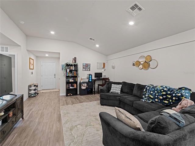 15579/15581 Chamberlain Blvd, Port Charlotte, FL 33953 - living area with lofted ceiling, light wood-type flooring, and visible vents