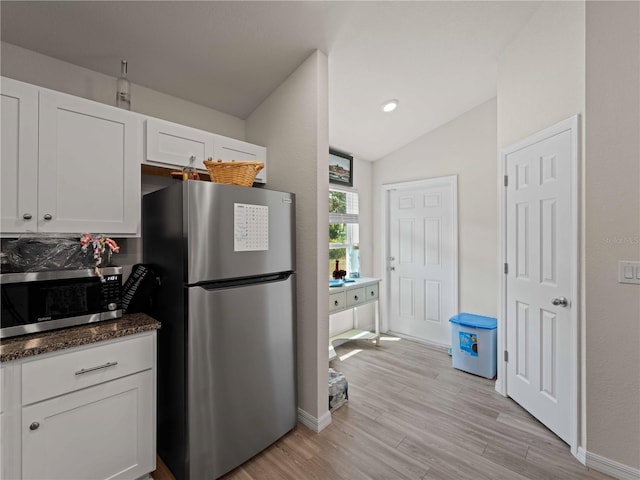 15579/15581 Chamberlain Blvd, Port Charlotte, FL 33953 - kitchen featuring light wood-style floors, white cabinetry, vaulted ceiling, and stainless steel appliances