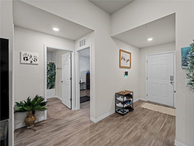 15579/15581 Chamberlain Blvd, Port Charlotte, FL 33953 - foyer with recessed lighting, baseboards, visible vents, and light wood finished floors
