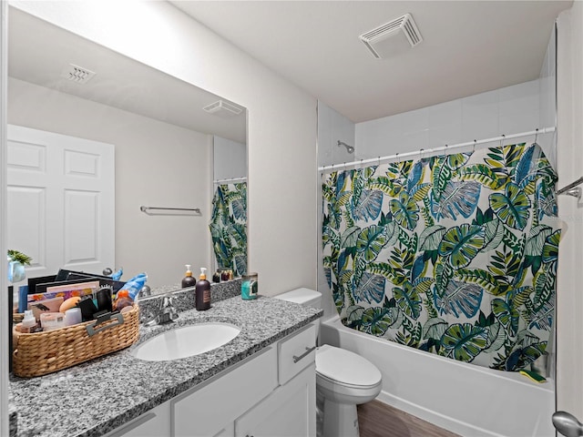 15579/15581 Chamberlain Blvd, Port Charlotte, FL 33953 - bathroom with toilet, visible vents, shower / bathtub combination with curtain, and vanity