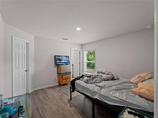 15579/15581 Chamberlain Blvd, Port Charlotte, FL 33953 - bedroom featuring visible vents, baseboards, and wood finished floors