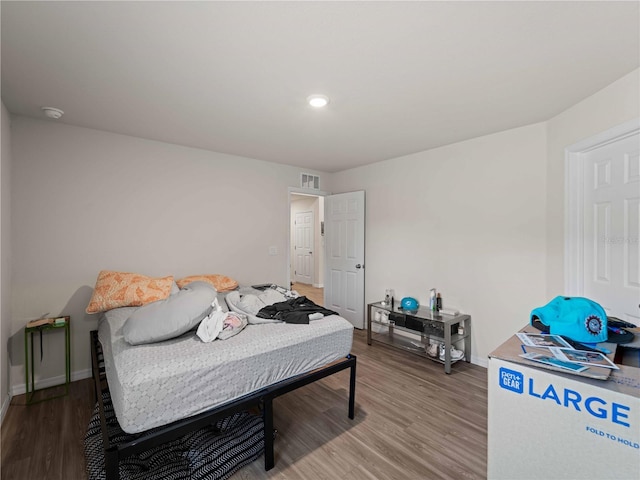 15579/15581 Chamberlain Blvd, Port Charlotte, FL 33953 - bedroom with recessed lighting, baseboards, visible vents, and wood finished floors