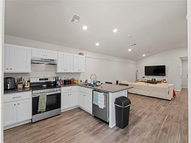 15579/15581 Chamberlain Blvd, Port Charlotte, FL 33953 - kitchen featuring visible vents, a sink, a peninsula, under cabinet range hood, and stainless steel appliances