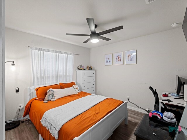 15579/15581 Chamberlain Blvd, Port Charlotte, FL 33953 - bedroom with baseboards, a ceiling fan, and dark wood-style flooring