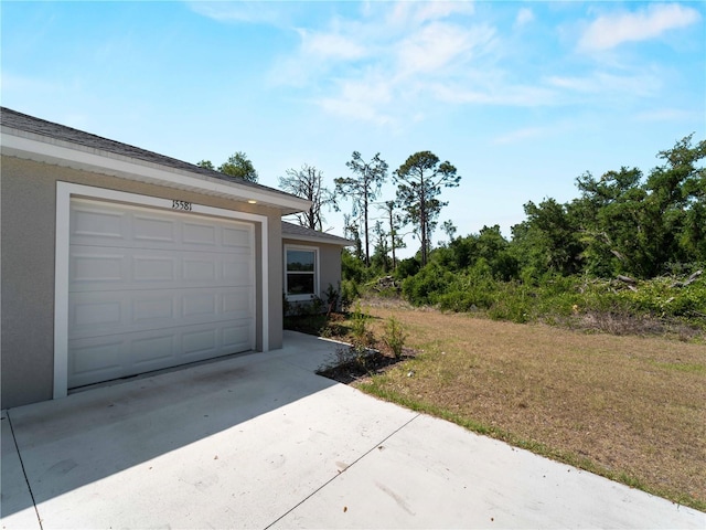15579/15581 Chamberlain Blvd, Port Charlotte, FL 33953 - garage featuring driveway