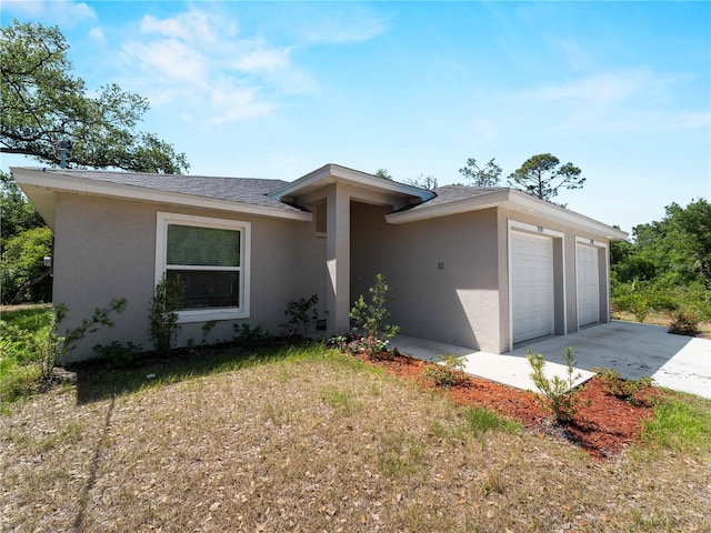 15579/15581 Chamberlain Blvd, Port Charlotte, FL 33953 - view of front of house with an attached garage and stucco siding