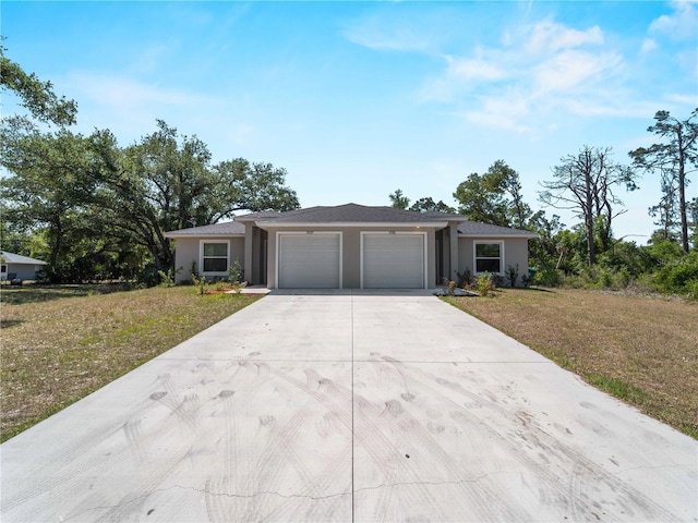 15579/15581 Chamberlain Blvd, Port Charlotte, FL 33953 - single story home featuring stucco siding, driveway, a front lawn, and a garage