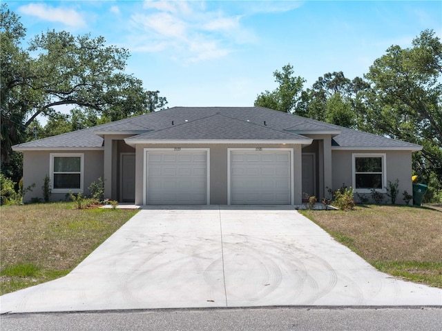 15579/15581 Chamberlain Blvd, Port Charlotte, FL 33953 - ranch-style house with an attached garage, concrete driveway, stucco siding, and a front yard