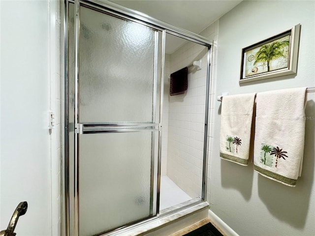 full bath with a shower stall