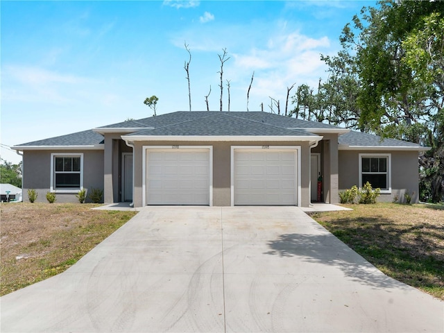 17190/17192 Nixon Ave, Port Charlotte, FL 33948 - view of front of home featuring an attached garage, concrete driveway, stucco siding, and a front yard