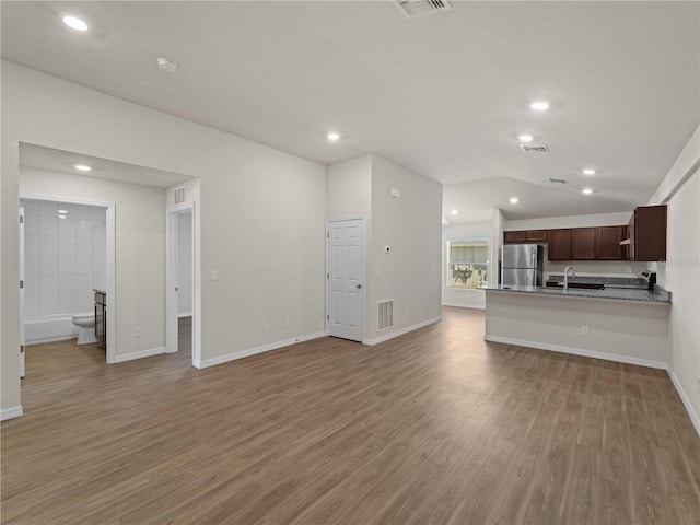 17190/17192 Nixon Ave, Port Charlotte, FL 33948 - unfurnished living room featuring recessed lighting, baseboards, light wood finished floors, and visible vents