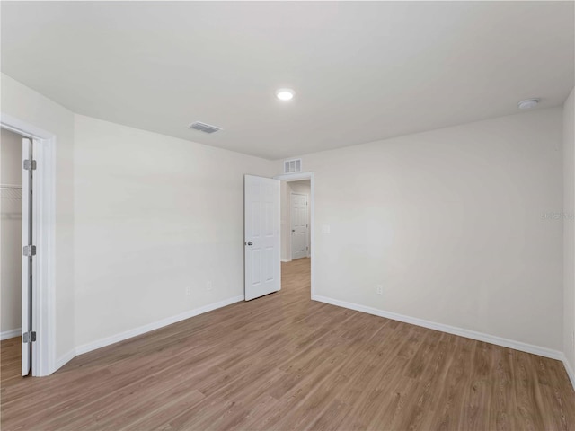 17190/17192 Nixon Ave, Port Charlotte, FL 33948 - spare room featuring baseboards, visible vents, and light wood-style floors