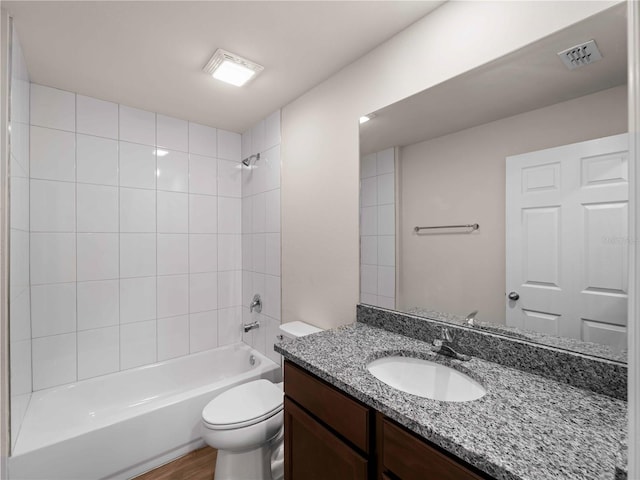 17190/17192 Nixon Ave, Port Charlotte, FL 33948 - bathroom with visible vents, bathtub / shower combination, wood finished floors, vanity, and toilet