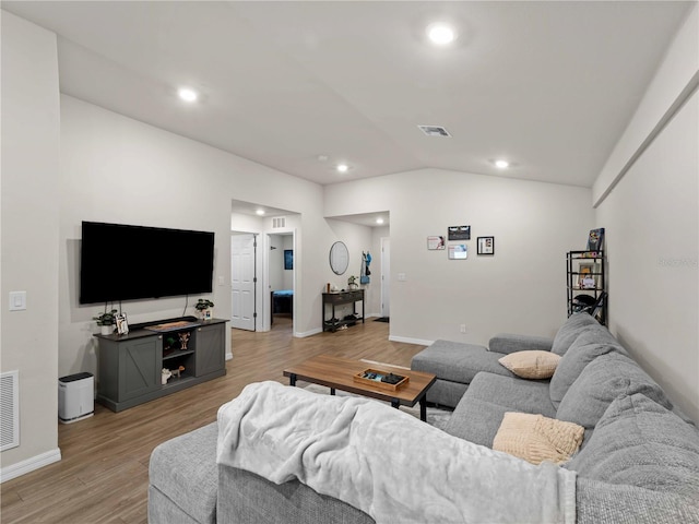 17190/17192 Nixon Ave, Port Charlotte, FL 33948 - living room with visible vents, recessed lighting, light wood-style floors, and lofted ceiling