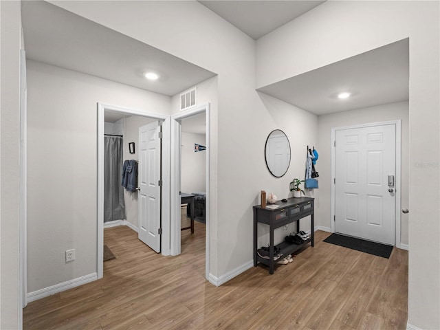 17190/17192 Nixon Ave, Port Charlotte, FL 33948 - entryway featuring visible vents, light wood-style flooring, and baseboards
