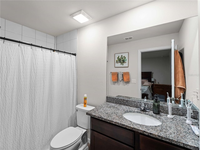 17190/17192 Nixon Ave, Port Charlotte, FL 33948 - ensuite bathroom featuring vanity, ensuite bath, toilet, curtained shower, and visible vents