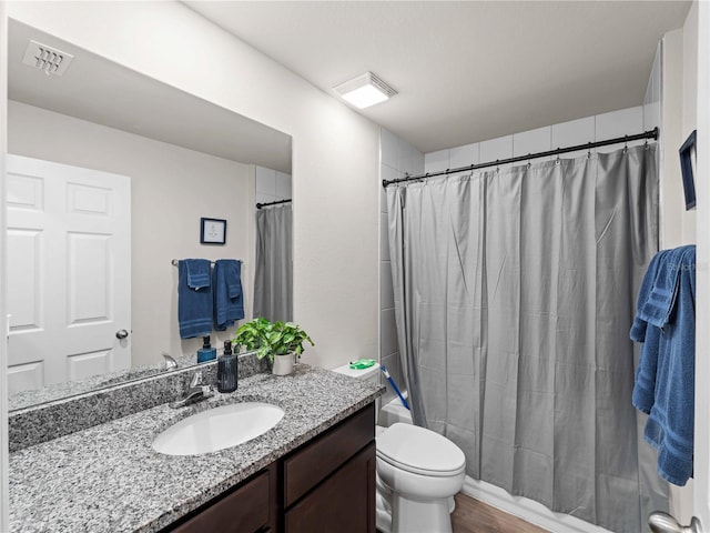 17190/17192 Nixon Ave, Port Charlotte, FL 33948 - full bath featuring visible vents, shower / tub combo with curtain, toilet, and vanity