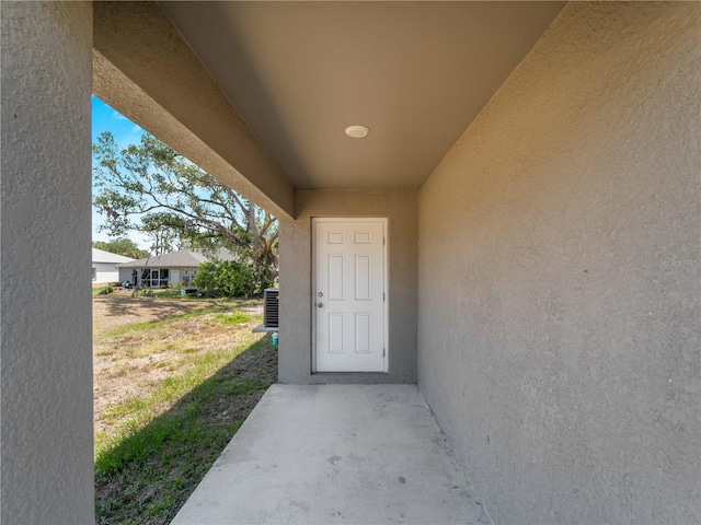 17190/17192 Nixon Ave, Port Charlotte, FL 33948 - property entrance with stucco siding and central AC