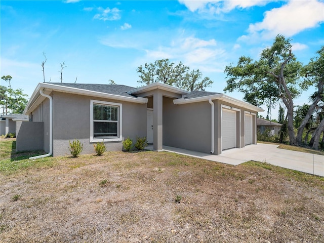 17190/17192 Nixon Ave, Port Charlotte, FL 33948 - view of front of house featuring stucco siding, concrete driveway, a shingled roof, and a garage