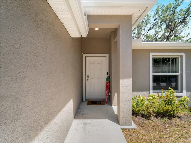 17190/17192 Nixon Ave, Port Charlotte, FL 33948 - doorway to property with stucco siding