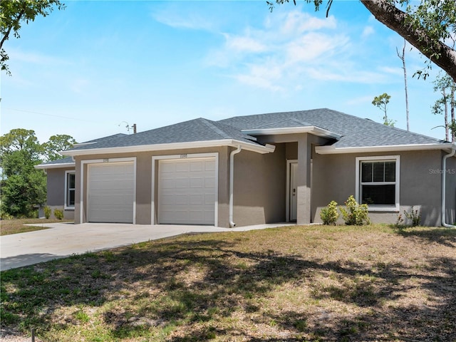 17190/17192 Nixon Ave, Port Charlotte, FL 33948 - prairie-style house with a garage, stucco siding, and concrete driveway