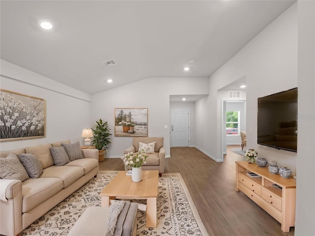 17190/17192 Nixon Ave, Port Charlotte, FL 33948 - living area with visible vents, recessed lighting, wood finished floors, and vaulted ceiling