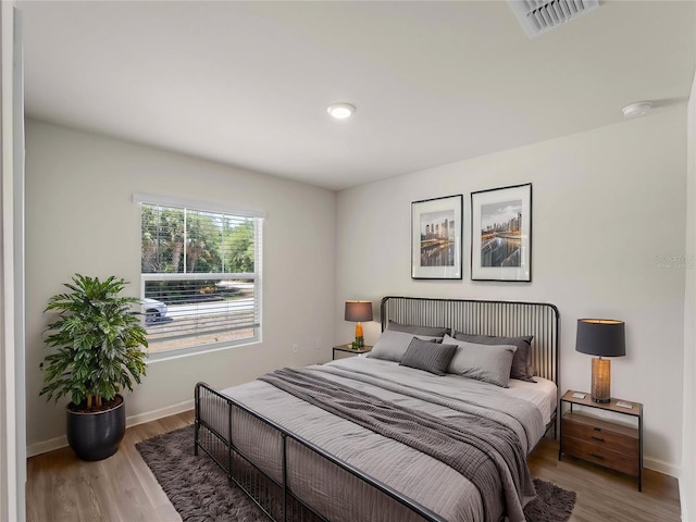 17190/17192 Nixon Ave, Port Charlotte, FL 33948 - bedroom with baseboards, wood finished floors, and visible vents
