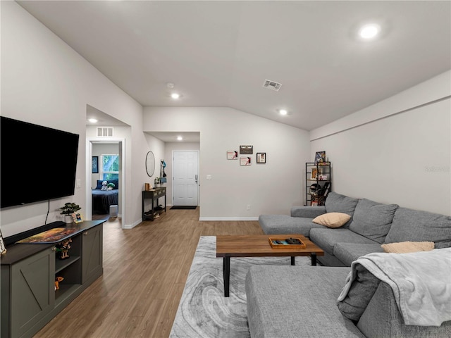 17190/17192 Nixon Ave, Port Charlotte, FL 33948 - living room featuring recessed lighting, lofted ceiling, light wood finished floors, and visible vents