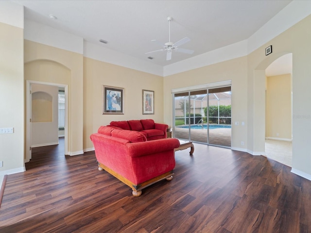 857 Macaw Cir, Venice, FL 34285 - living room with ceiling fan, visible vents, wood finished floors, and arched walkways