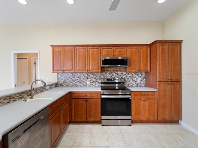 857 Macaw Cir, Venice, FL 34285 - kitchen with a sink, tasteful backsplash, light countertops, and appliances with stainless steel finishes