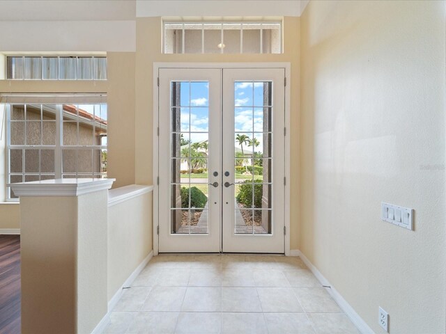 857 Macaw Cir, Venice, FL 34285 - entryway featuring french doors, baseboards, and tile patterned flooring