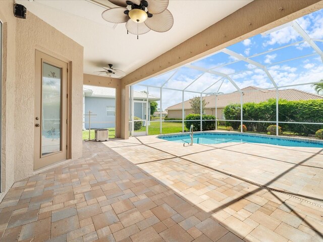 857 Macaw Cir, Venice, FL 34285 - outdoor pool featuring ceiling fan, a patio area, and glass enclosure
