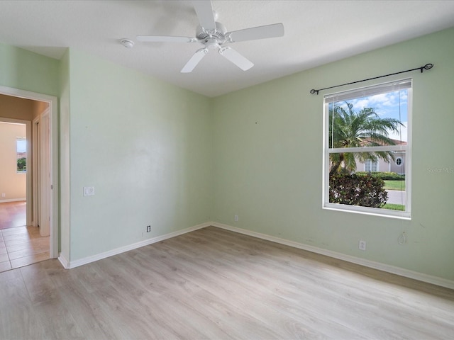 857 Macaw Cir, Venice, FL 34285 - spare room featuring baseboards, light wood-style floors, and ceiling fan
