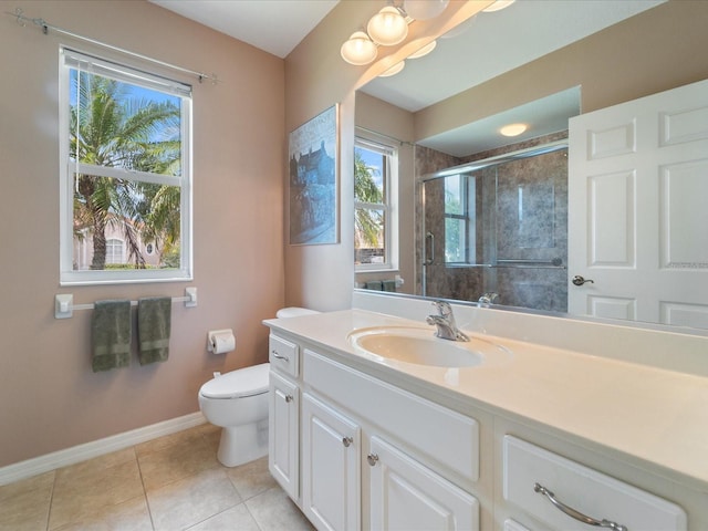 857 Macaw Cir, Venice, FL 34285 - full bathroom with toilet, vanity, tile patterned floors, a shower stall, and baseboards