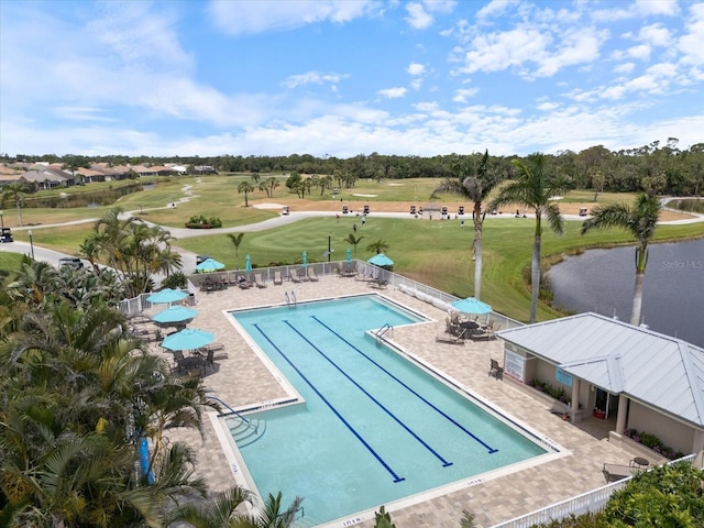 857 Macaw Cir, Venice, FL 34285 - pool featuring a patio area, a water view, fence, and a lawn